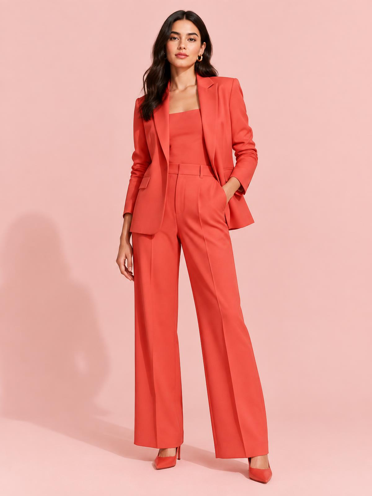 A model wearing a coral suit